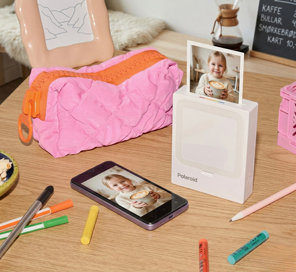 Polaroid Hi-Print smartphone printer displaying photo