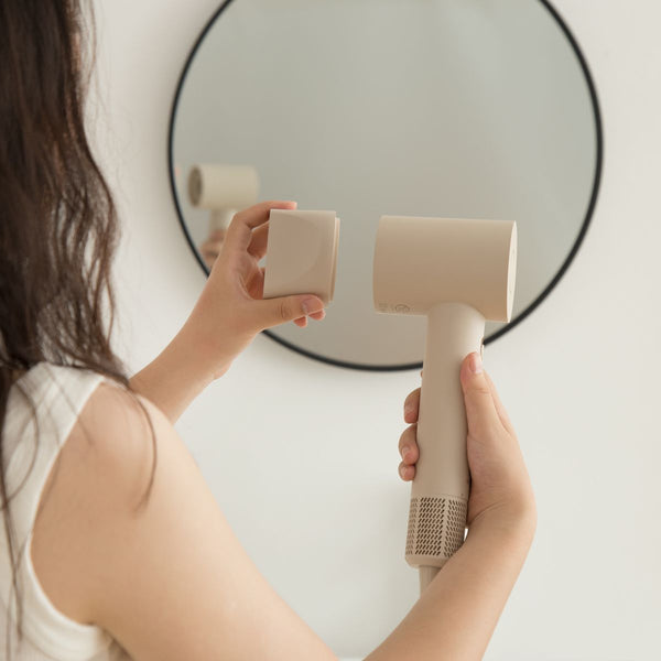 BRUNO BAK811 compact hair dryer used in front of a mirror